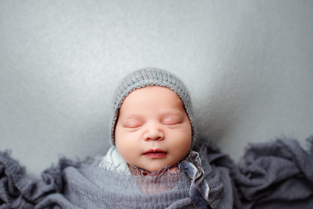 Baby boy in blue bonnet portrait in St. Johns, FL