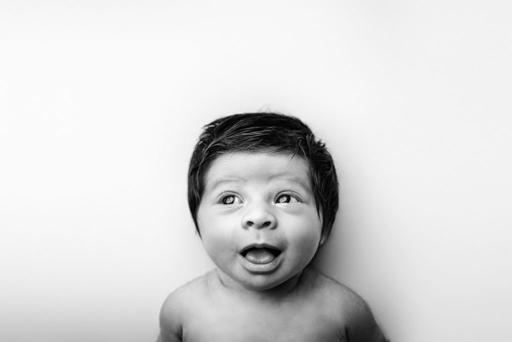 Black and white newborn expression portrait in Jacksonville, FL